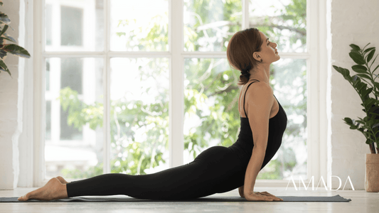 A woman stretching in her living room before her yoga session.